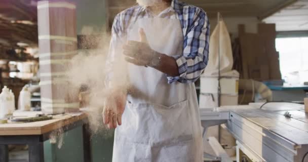 African American Male Carpenter Wearing Apron Dusting His Hands Carpentry — Stockvideo