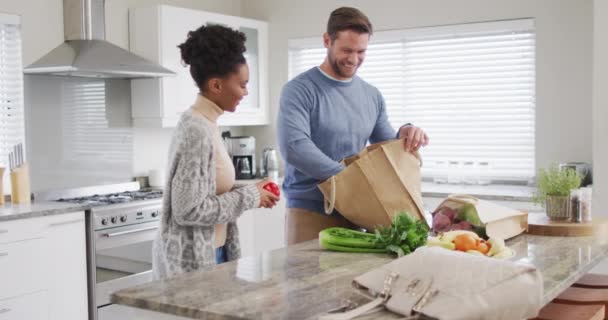 Video Happy Diverse Couple Unpacking Groceries Kitchen Love Relationship Spending — Vídeos de Stock