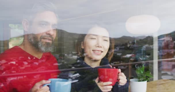 Happy Diverse Couple Drinking Coffee Talking Together Home Spending Quality — Vídeo de stock