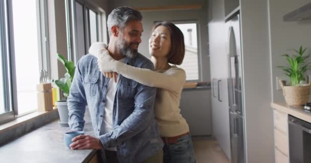 Happy Diverse Couple Wearing Casual Clothes Embracing Together Kitchen Spending — Video Stock