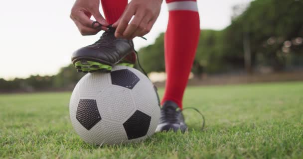 Video Biracial Football Player Ball Tie Laces Male Football Team — Video
