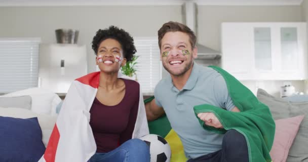 Video Happy Diverse Couple Holding Flags Portugal England Watching Match — Vídeos de Stock