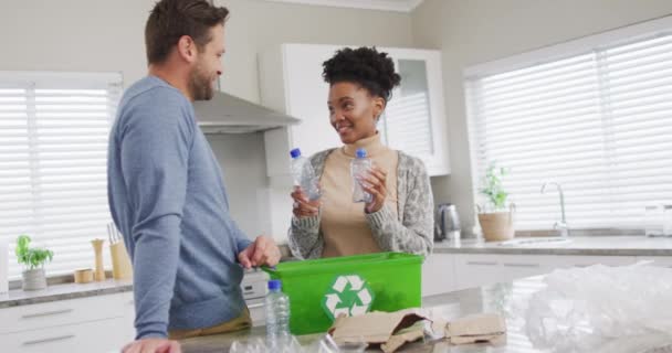 Video Happy Diverse Couple Collecting Plastic Bottles Recycling Home Relationship — ストック動画