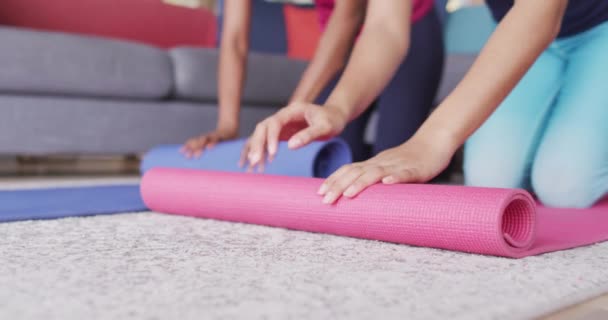Video Midsection Diverse Female Friends Rolling Yoga Mats Home Friendship — Video Stock