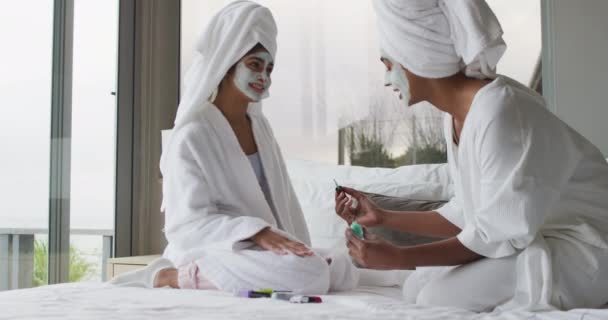 Video Happy Diverse Female Friends Moisturizing Face Masks Painting Nails — Videoclip de stoc