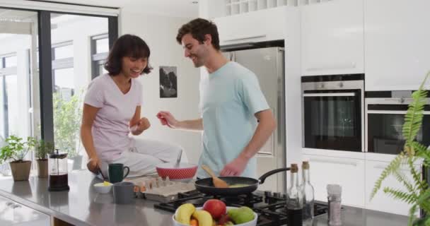 Video Happy Diverse Couple Using Smartphone Kitchen Love Relationship Spending — Stock video