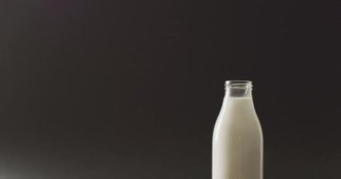 Video of biscuits with chocolate and milk on dark background. cookies,bake, food, candy, snacks and sweets concept.