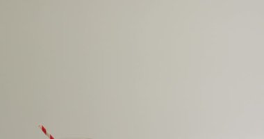 Video of glass of fresh milk on white background. dairy products and healthy organic nutrition.