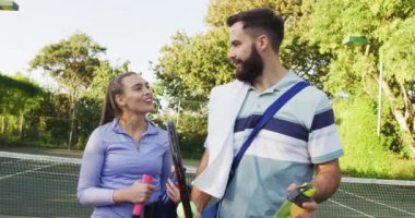 Video of happy caucasian couple on the court. Healthy active lifestyle and fitness at home.