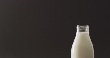 Video of biscuits with chocolate and milk on dark background. cookies,bake, food, candy, snacks and sweets concept.