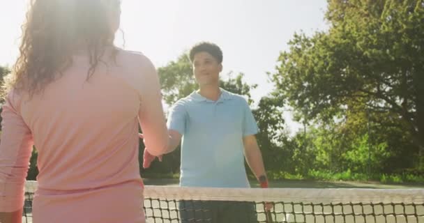 Video Happy Biracial Couple Playing Tennis Court Healthy Active Lifestyle — Stockvideo