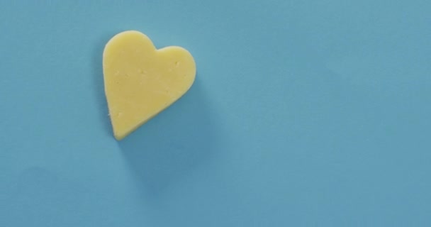 Video Heart Shape Cheese Blue Background Copy Space Savoury Food — Stockvideo
