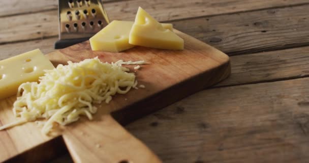 Video Yellow Cheese Grated Cheese Wooden Board Cheese Grater Rustic — Vídeo de Stock