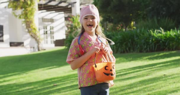 Video Happy Caucasian Girl Nurse Costume Holding Halloween Trick Treat — Wideo stockowe