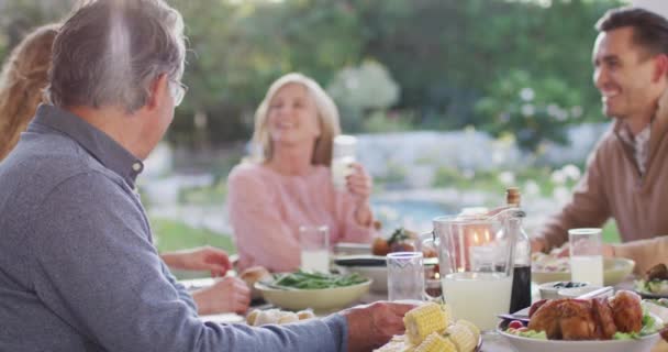 Video Happy Caucasian Parents Daughter Grandparents Talking Outdoor Dinner Table — Stok video