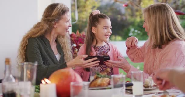 Video Happy Caucasian Mother Daughter Grandmother Looking Smartphone Dinner Table — Wideo stockowe