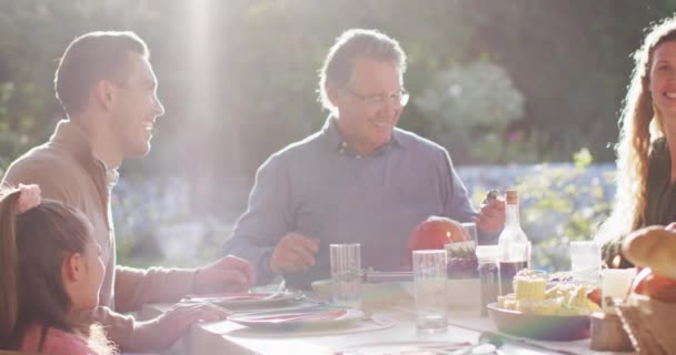 Video Happy Caucasian Parents Daughter Grandparents Sitting Sunny Outdoor Table — Stok video