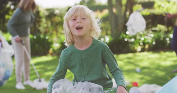 Video Portrait Smiling Caucasian Boy Collecting Plastic Recycling Family Outdoors — Video
