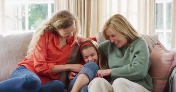 Video Happy Caucasian Mother Grandmother Tickling Laughing Granddaughter Couch Family — Αρχείο Βίντεο