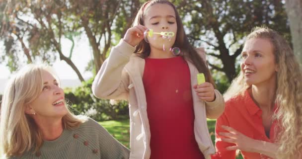 Video Happy Caucasian Daughter Blowing Bubbles Mother Grandmother Autumn Garden — Wideo stockowe