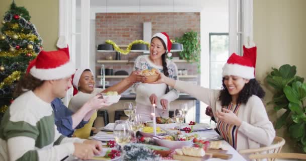 Happy Group Diverse Friends Santa Hats Celebrating Meal Christmas Time — Stock Video