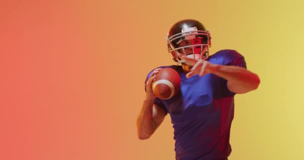 Video Close Caucasian American Football Player Helmet Ball Orange Background — Stock Video