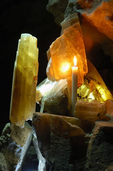 Lamellar crystals of gypsum and candle — Stock Photo, Image