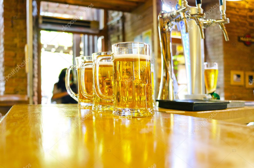 three glasses of beer at the bar