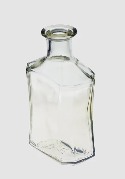 Üveg pálinka, egy szürke háttér — Stock Fotó