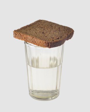 Bread food portion on vodka alcohol drinking glass , on a gray background clipart