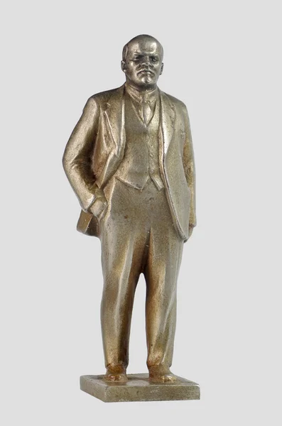 列宁在灰色的背景上的那个小老镍银雕像 — 图库照片