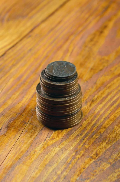 Old English coinage on a wooden table — Stock Photo, Image