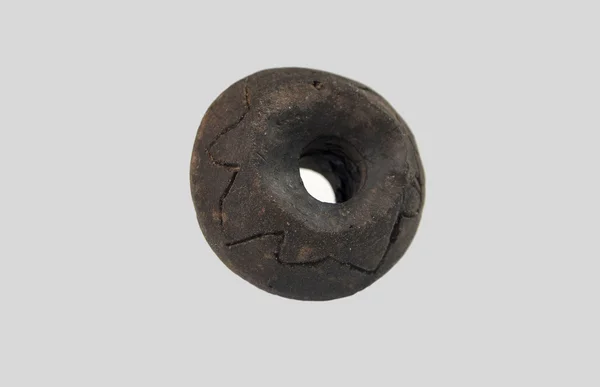 Old ceramic spindle whorl — Stock Photo, Image