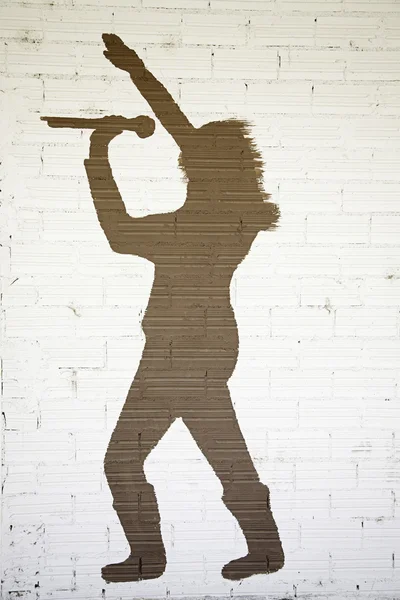 Sänger auf Ziegelmauer — Stockfoto