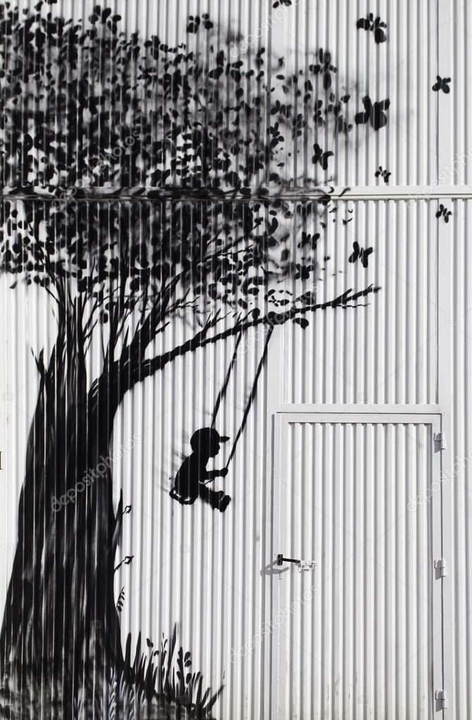 Child swinging in tree