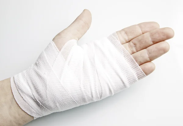 Ligaduras de mão com inflamação — Fotografia de Stock