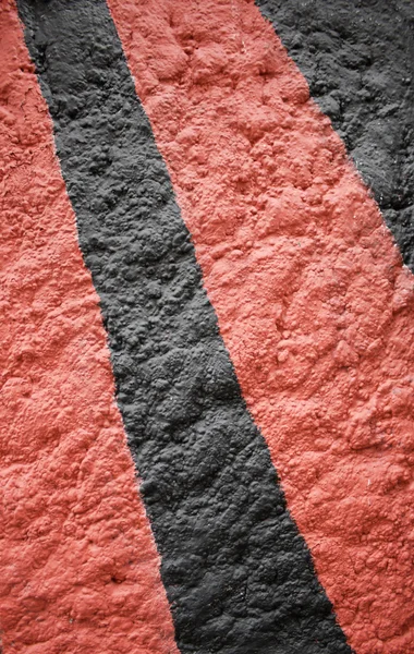 Schwarz und rot strukturierte Oberfläche — Stockfoto