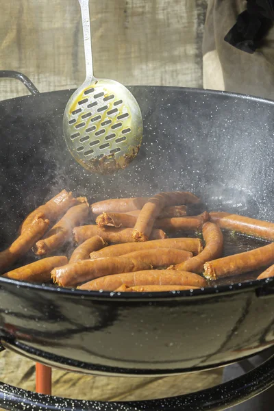 Cooking sausage — Stock Photo, Image