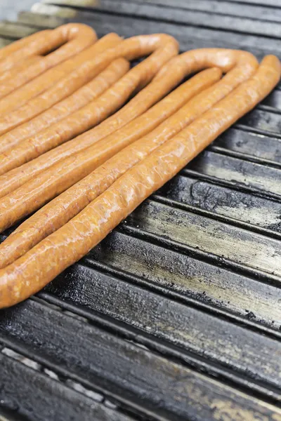 Brazier with sausage — Stock Photo, Image