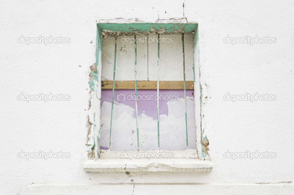 Broken window with bars