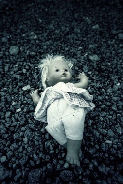 Detail of old abandoned and lonely toy, dirt and sadness