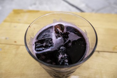 Detail of alcoholic beverage of wine and cola