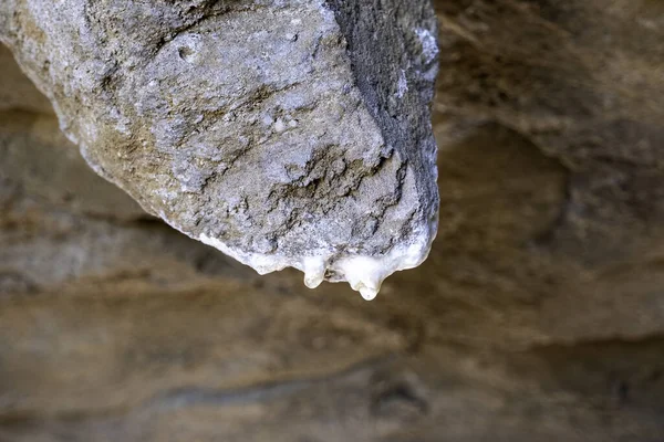 Detail of water falling on an ancient rock formation