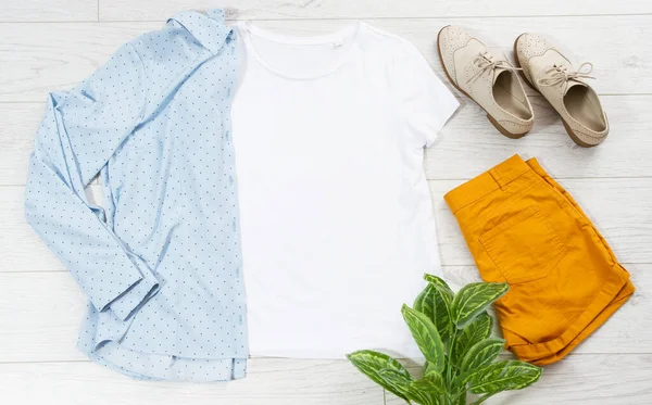 T-shirt copy space, blue shirt yellow shirts top view casual clothes background