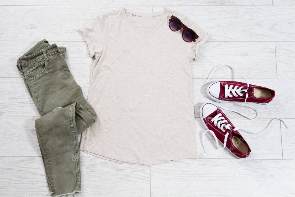 T-shirt top view, t shirt mock up, empty tshirt. Summer concept casual clothes background copy space. Blank shirt on wooden background