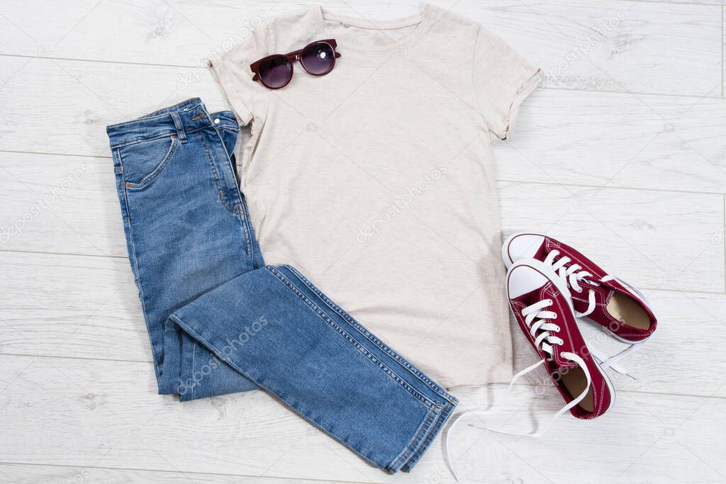 T-shirt top view, t shirt mock up, empty tshirt. Summer concept casual clothes background copy space. Blank shirt on wooden background