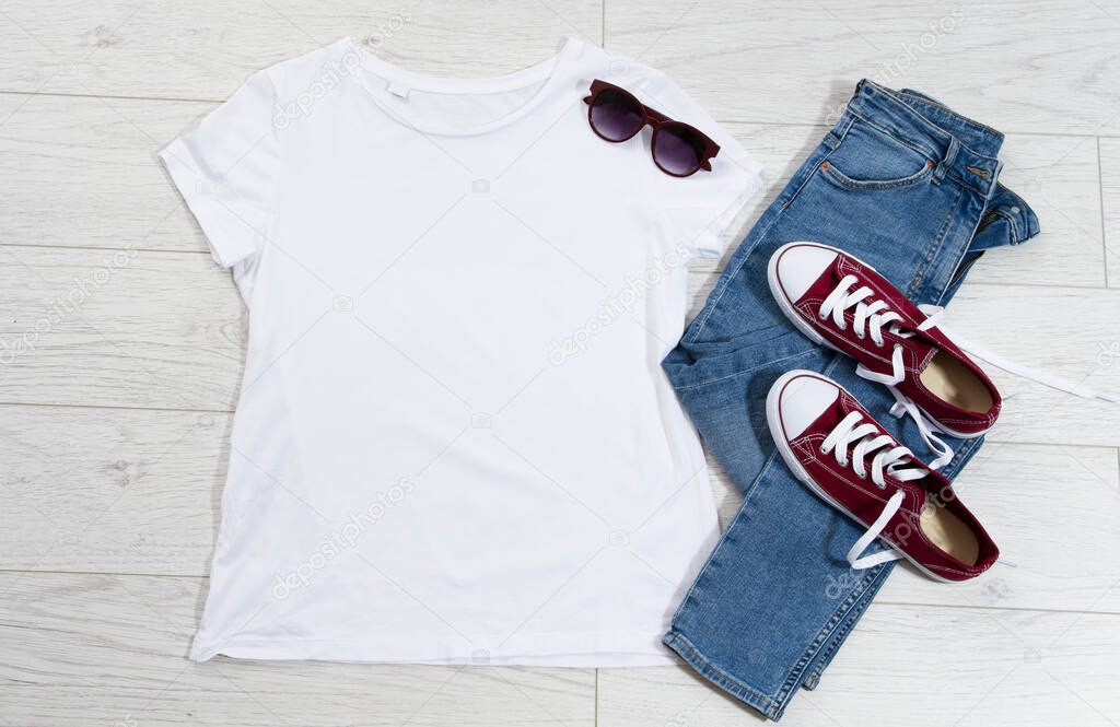 T-shirt top view, t shirt mock up, empty tshirt. Summer concept casual clothes background copy space. Blank shirt on wooden background