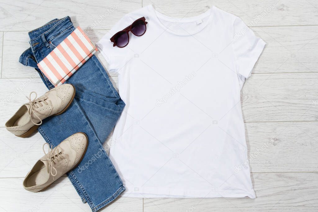Tshirt t-shirt t shirt mock up top view on wooden floor, clothes background copy space shirt flatlay