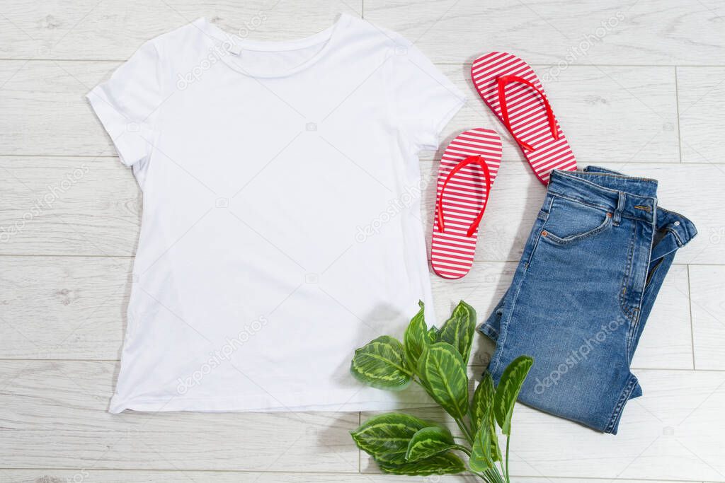 Tshirt t-shirt t shirt mock up top view on wooden floor, clothes background copy space shirt flatlay