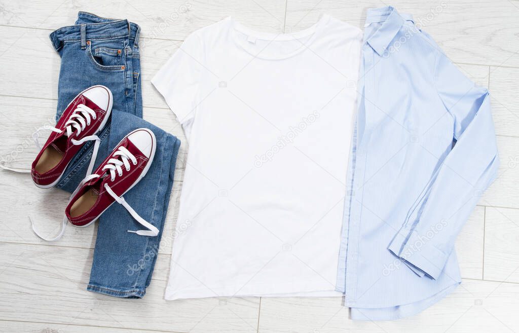 Clothes background top view, empty shirt fir your logo copy space mock up, t-shirt mockup isolated on wooden floor, summer vacation concept, male and female t shirt